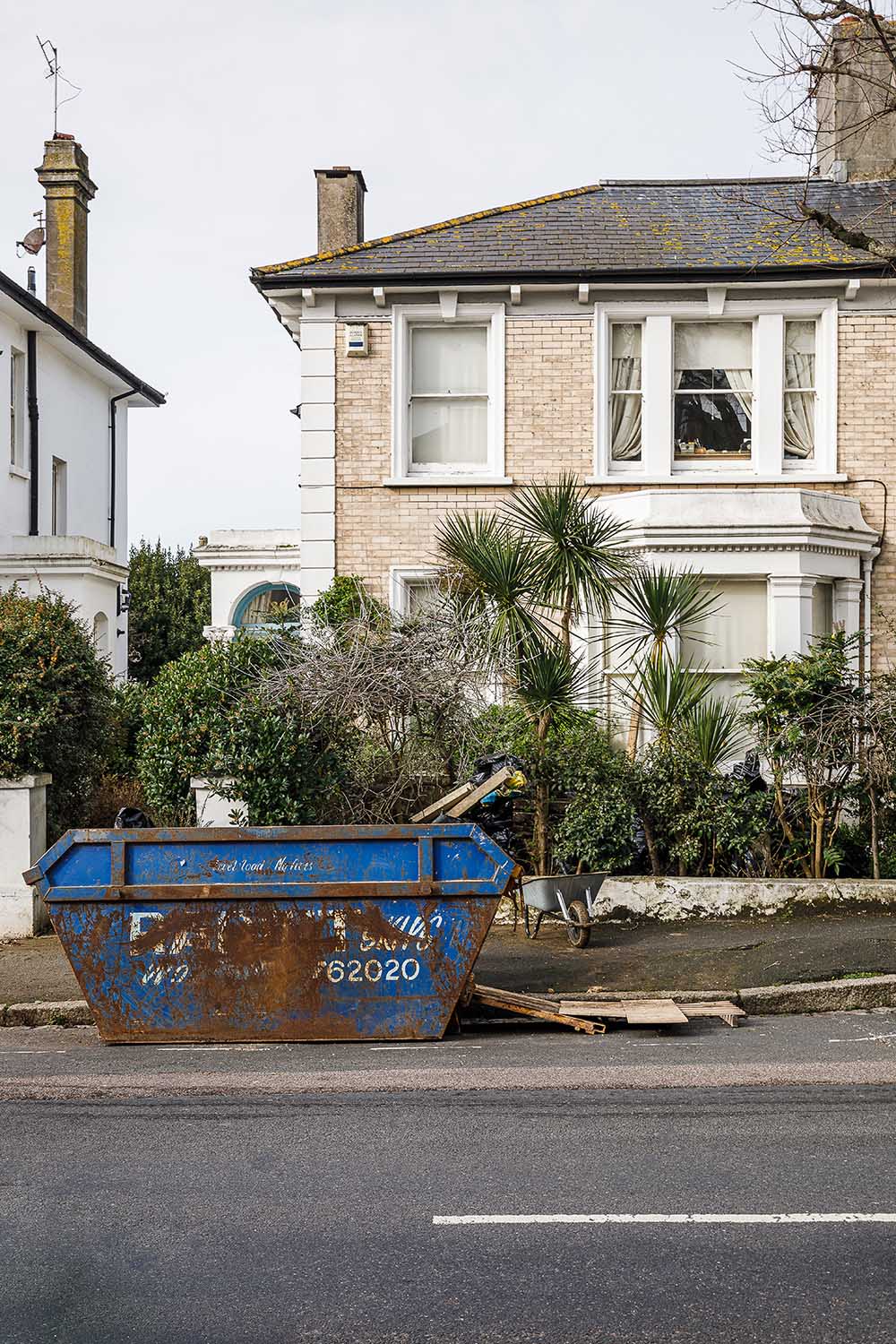 streetview of skip in front of a house