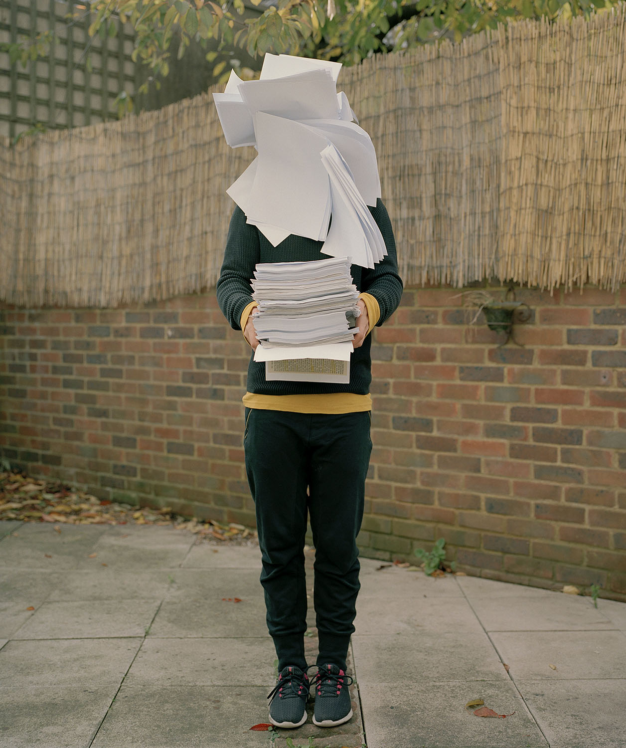 falling stacked papers in front of full body shot