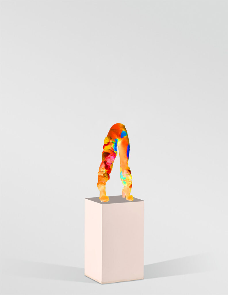 multi colour patch legs standing on plinth