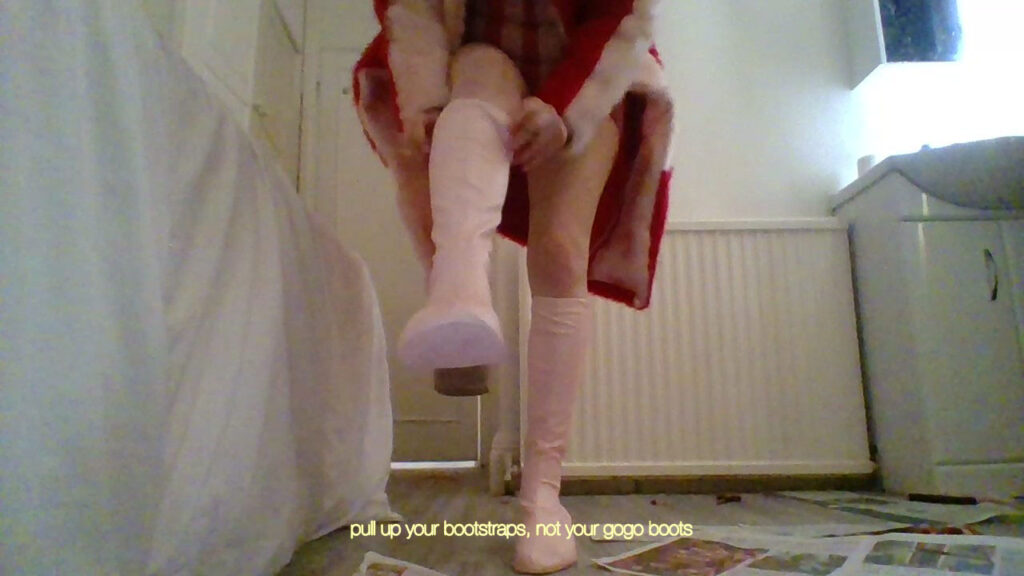 Film still of a person pulling on a pair of thigh high pink boots