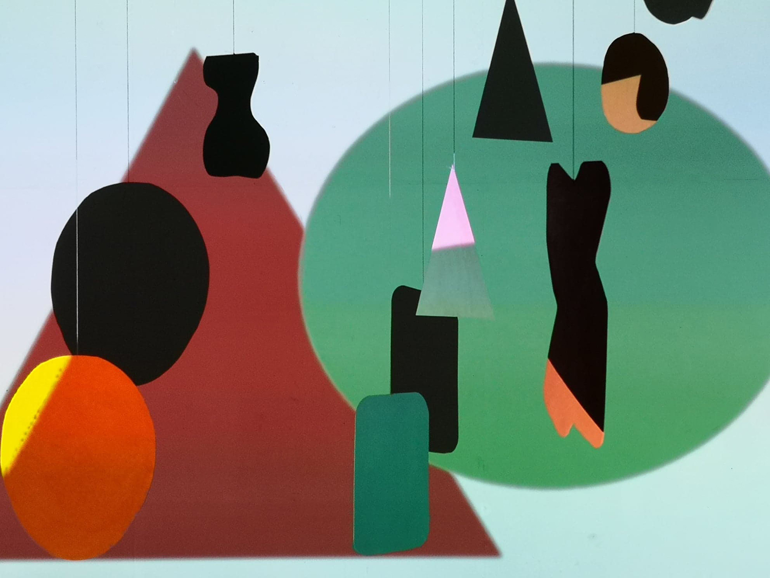Colourful collage of abstract shapes in green, brown and orange