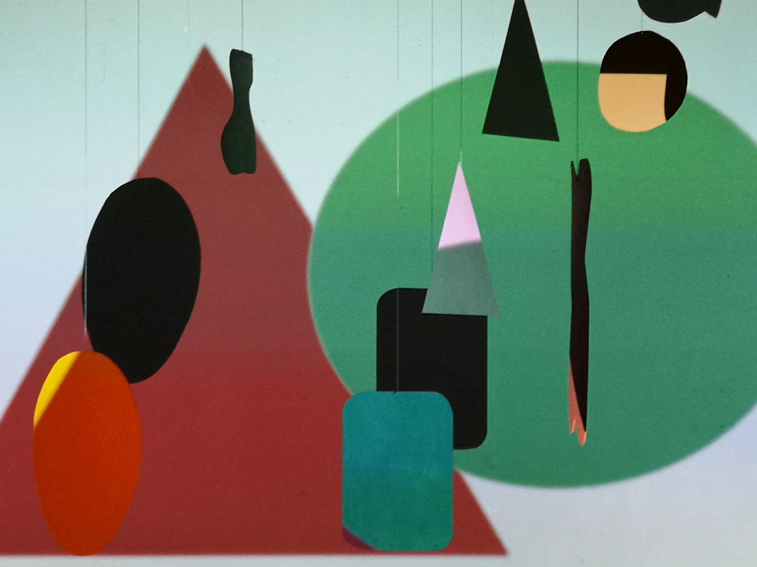 Colourful collage of abstract shapes in green, brown and orange