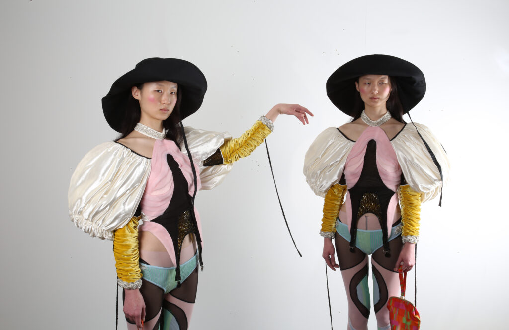Photo of two models in experimental costume