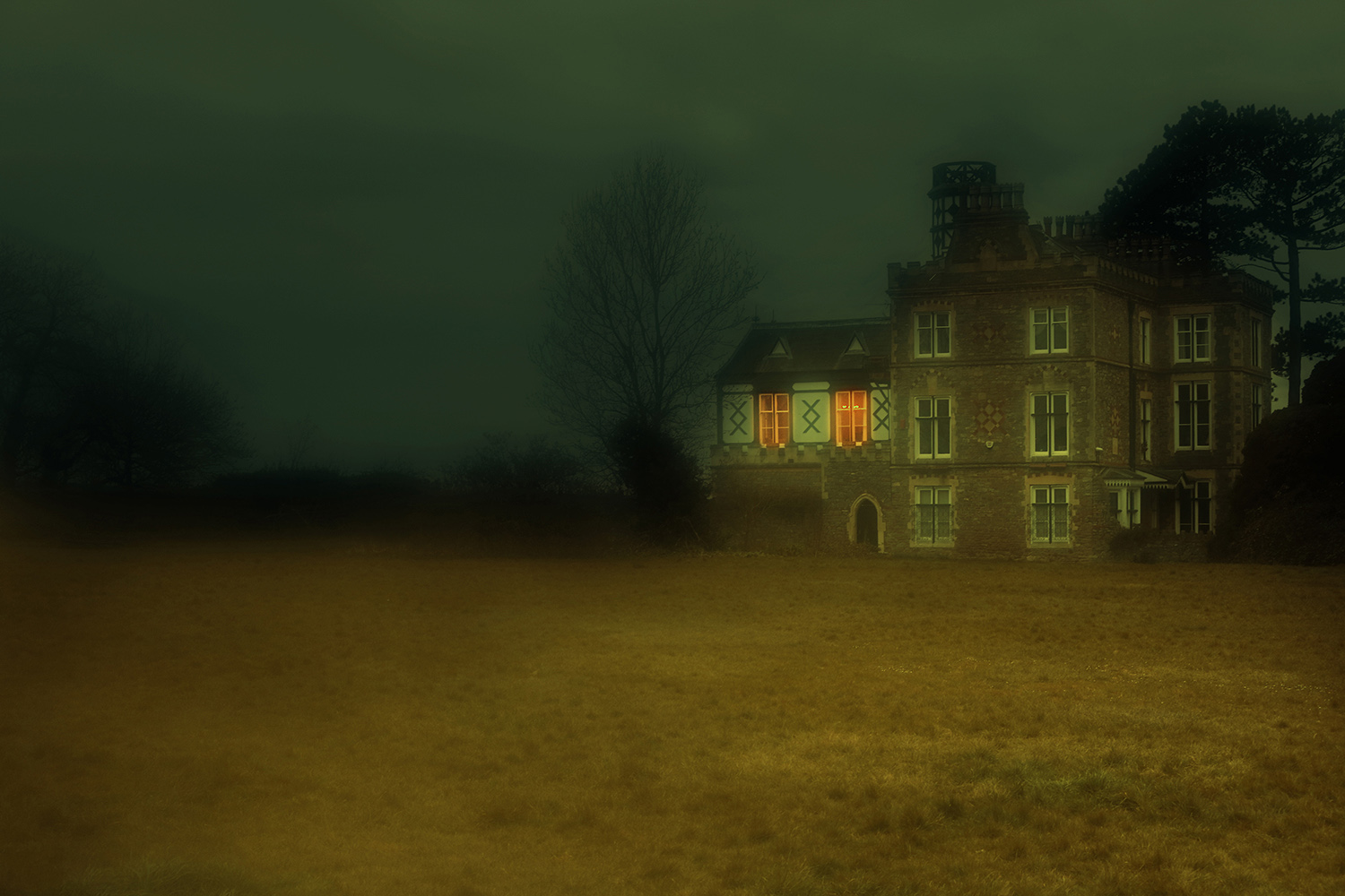 dark photo of a manor house