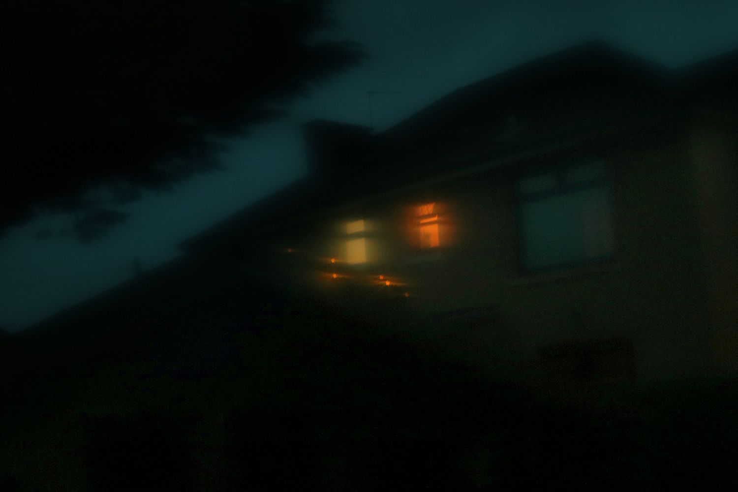 dark photo of suburban house