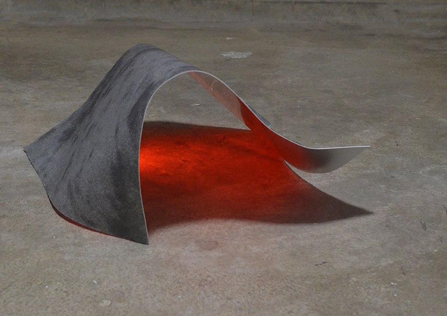 Fold of metal over red light
