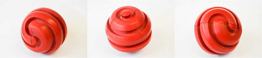 Red 8 sided Sphericon Stim Toy made from resin.